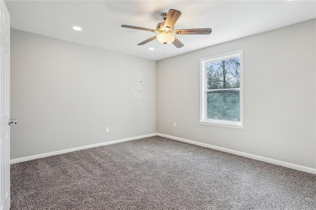 carpeted spare room featuring recessed lighting, ceiling fan, and baseboards