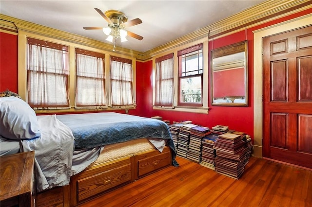 bedroom featuring wood finished floors and a ceiling fan