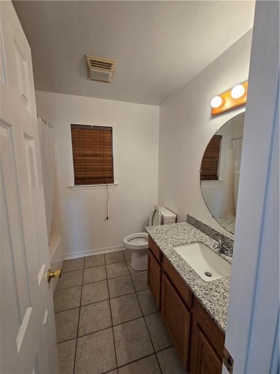 full bath featuring tile patterned flooring, toilet, vanity, visible vents, and baseboards