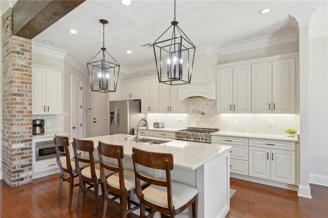 kitchen with stainless steel appliances, a sink, light countertops, and white cabinets