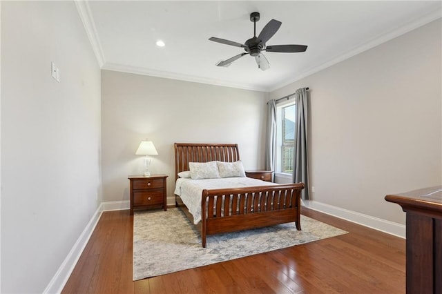 bedroom featuring ceiling fan, baseboards, wood finished floors, and ornamental molding