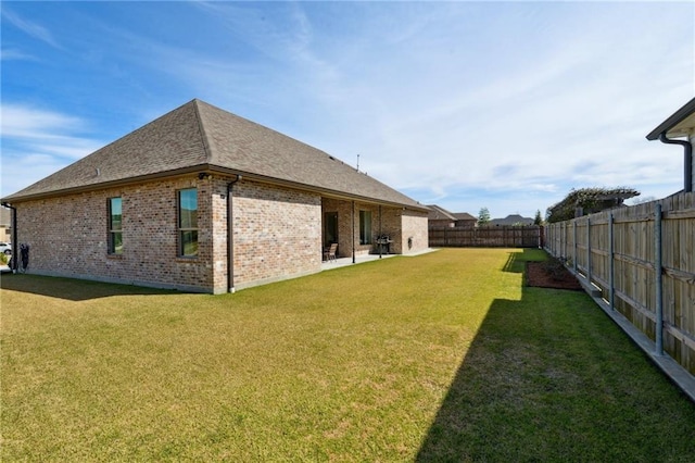 view of yard with a patio and a fenced backyard