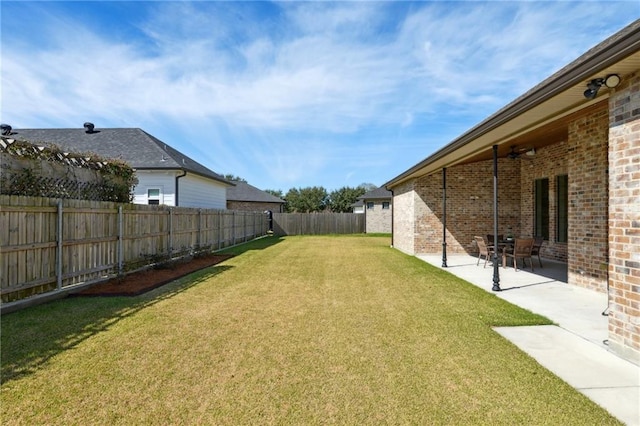 view of yard featuring a patio and a fenced backyard