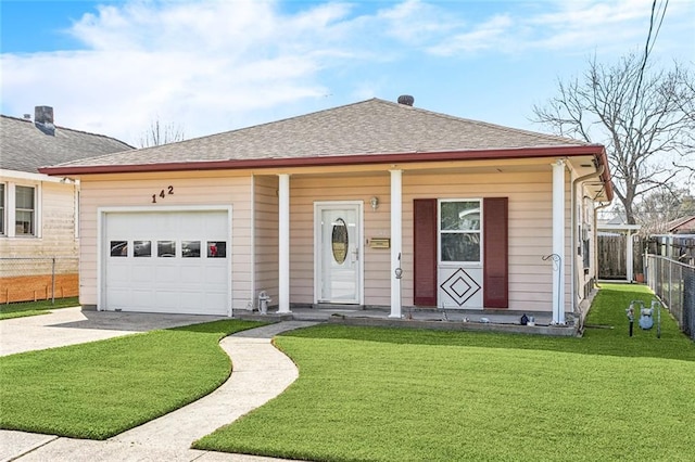 view of front of property with a porch, fence, driveway, roof with shingles, and a front yard