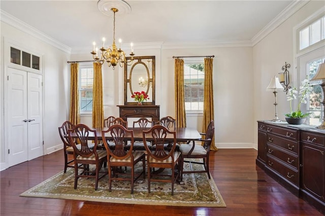 dining area with a wealth of natural light, crown molding, dark wood finished floors, and a notable chandelier