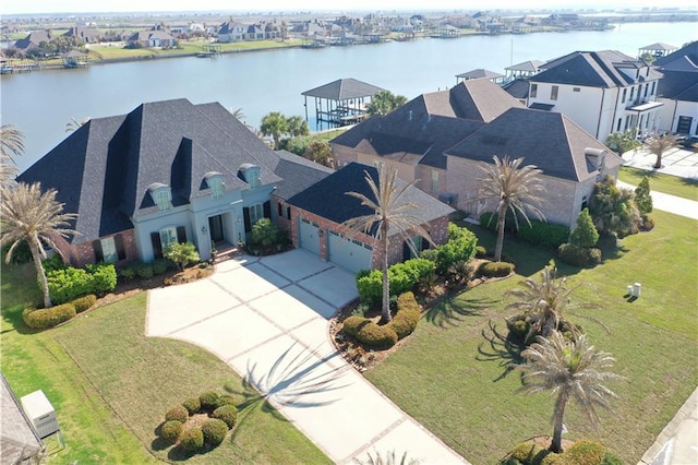 aerial view with a residential view and a water view