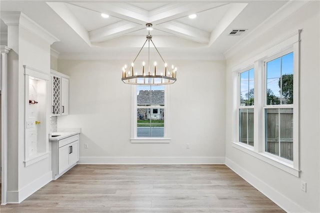 unfurnished dining area with visible vents, an inviting chandelier, light wood-type flooring, beam ceiling, and coffered ceiling