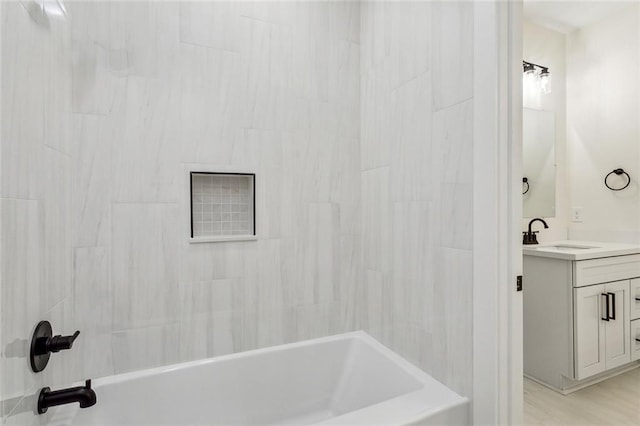 bathroom with shower / bathtub combination and vanity