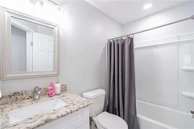 full bathroom featuring shower / tub combo, vanity, and toilet