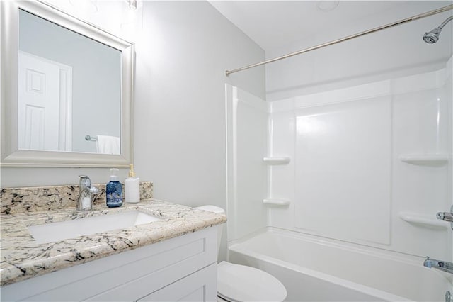 full bath featuring toilet, tub / shower combination, and vanity