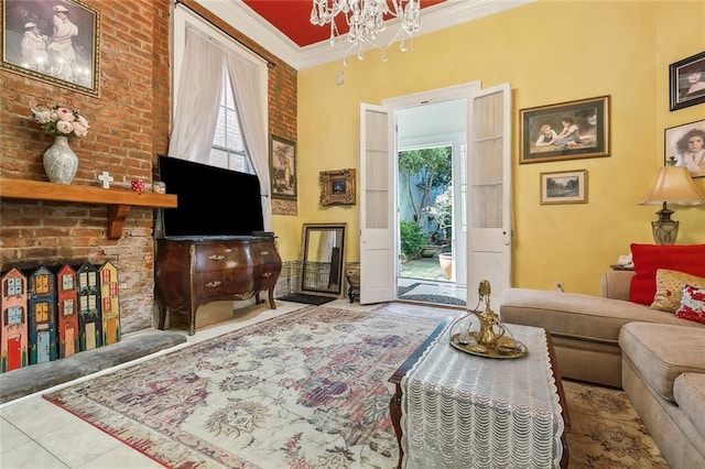 living area featuring a notable chandelier, ornamental molding, plenty of natural light, and tile patterned floors