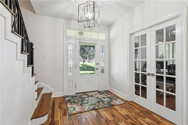 110 Rue Acadian, Belle Chasse, LA 70037 - foyer with stairs, baseboards, wood finished floors, and french doors