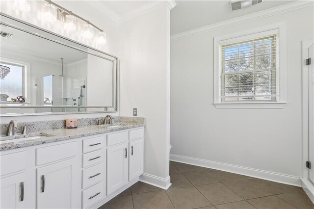 110 Rue Acadian, Belle Chasse, LA 70037 - bathroom with double vanity, visible vents, ornamental molding, a sink, and tile patterned flooring