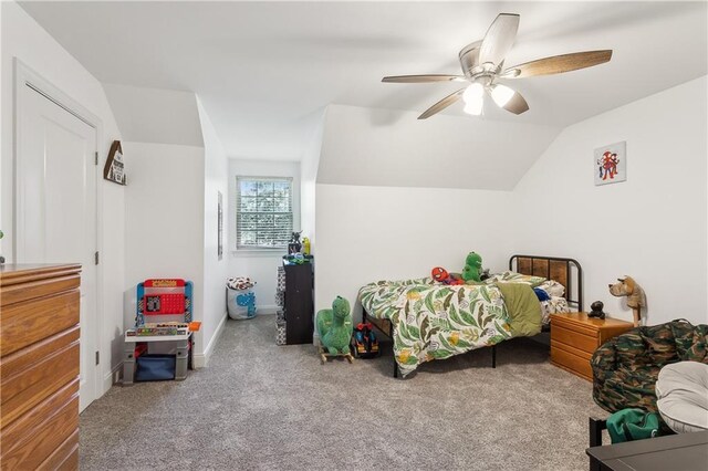 110 Rue Acadian, Belle Chasse, LA 70037 - bedroom with lofted ceiling, baseboards, a ceiling fan, and carpet flooring