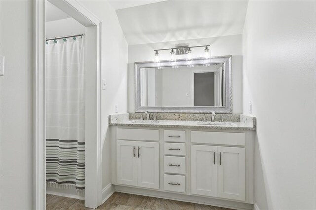 110 Rue Acadian, Belle Chasse, LA 70037 - full bathroom with a shower with curtain, a sink, and double vanity