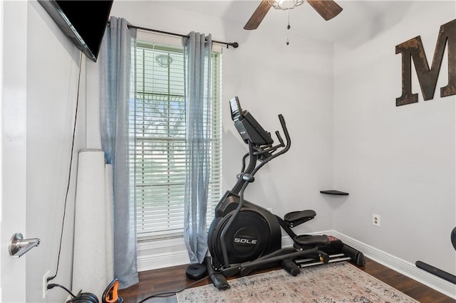 110 Rue Acadian, Belle Chasse, LA 70037 - workout area featuring dark wood-style floors, ceiling fan, and baseboards