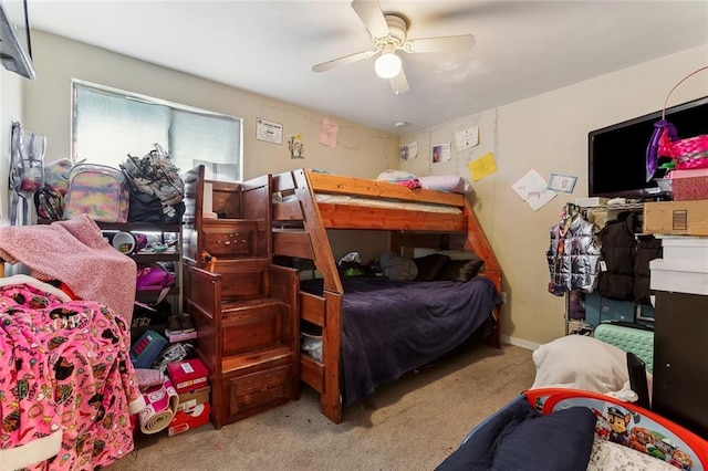 bedroom featuring a ceiling fan and light carpet