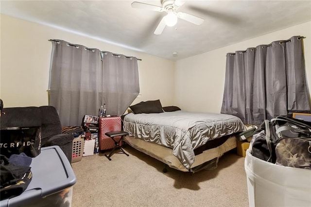 bedroom featuring ceiling fan and light colored carpet