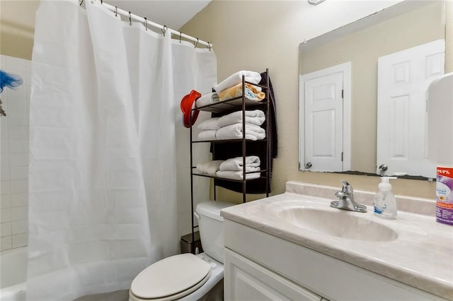 bathroom featuring toilet and vanity