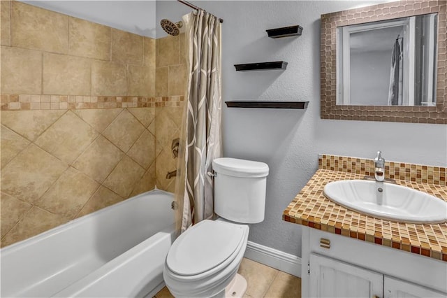 full bath featuring a textured wall, toilet, vanity, baseboards, and shower / bath combo with shower curtain