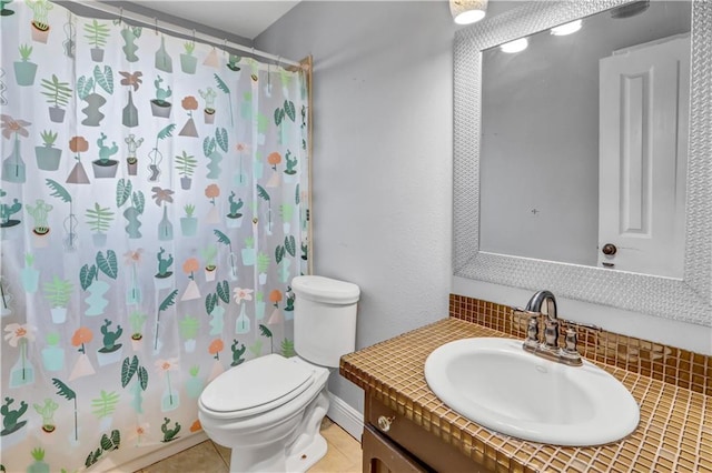 bathroom featuring toilet, curtained shower, vanity, and tile patterned floors