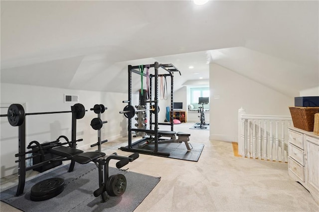 exercise area featuring recessed lighting, light colored carpet, visible vents, vaulted ceiling, and baseboards