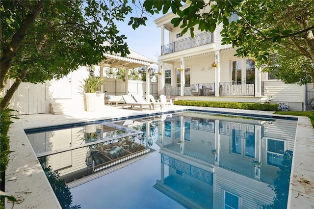 view of pool featuring a patio, fence, a fenced in pool, and a pergola