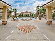 view of home's community with a patio area, a pool, and a hot tub