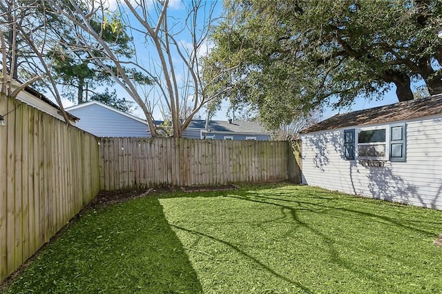 view of yard with a fenced backyard