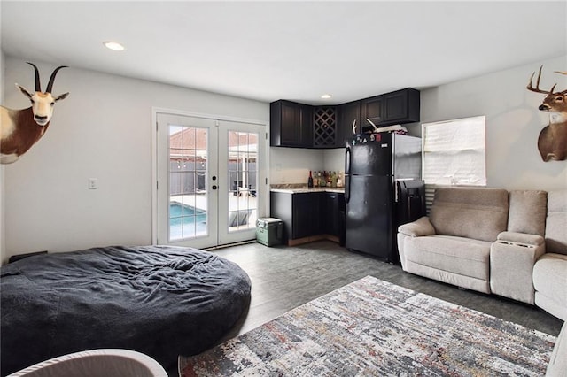 bedroom featuring freestanding refrigerator, access to outside, french doors, light wood-style floors, and recessed lighting