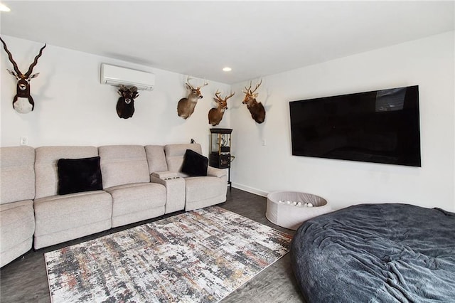 living room featuring recessed lighting, an AC wall unit, and baseboards