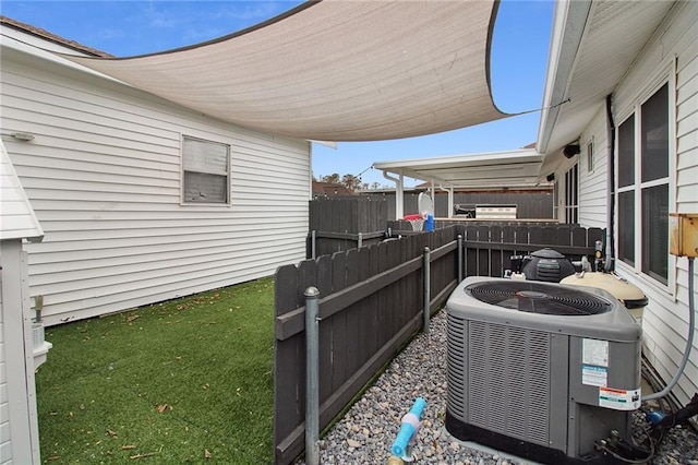 exterior space featuring fence and central air condition unit