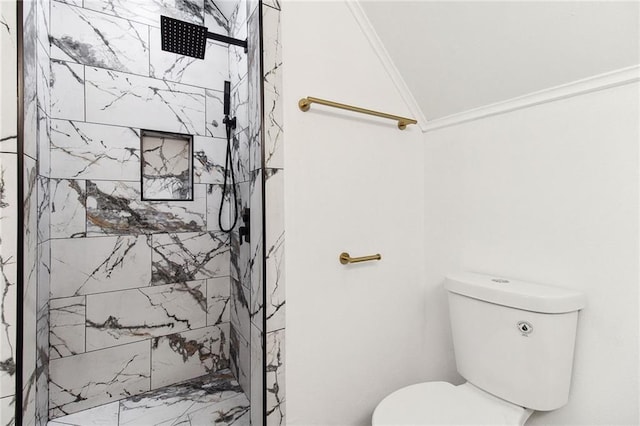 full bathroom featuring toilet, crown molding, and a marble finish shower