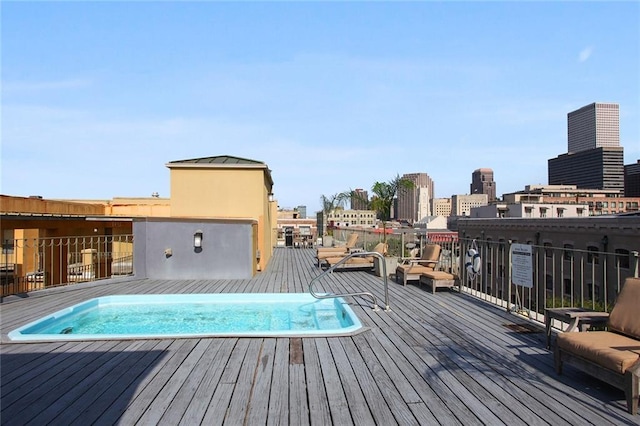 view of swimming pool with a city view