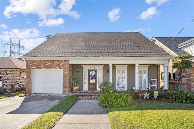 view of front of home with aphalt driveway, roof with shingles, brick siding, an attached garage, and a front lawn