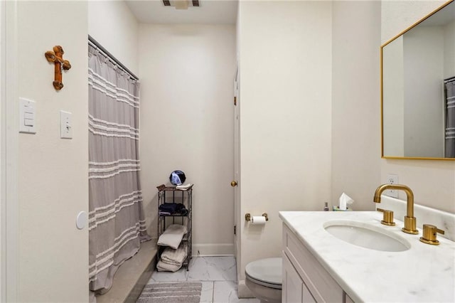 full bathroom featuring curtained shower, toilet, vanity, baseboards, and marble finish floor