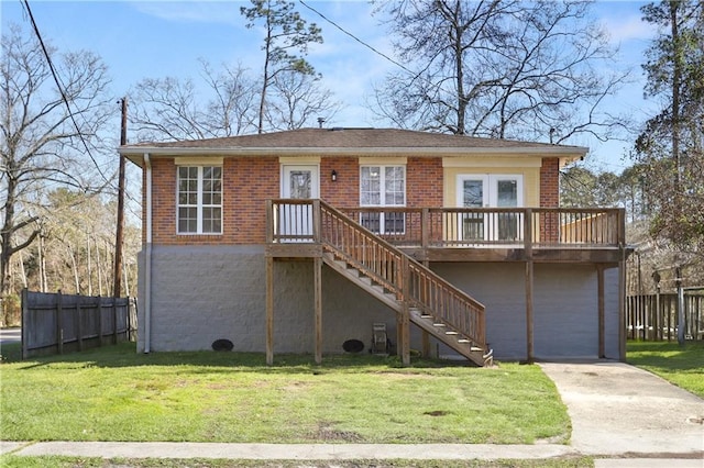 view of front of home with fence, stairway, a front lawn, and brick siding