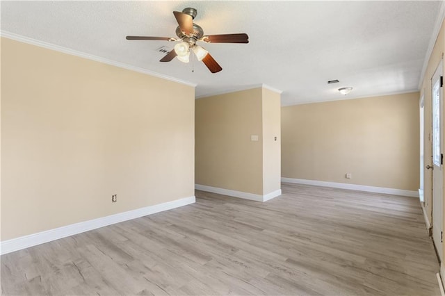 unfurnished room featuring ornamental molding, baseboards, and light wood finished floors