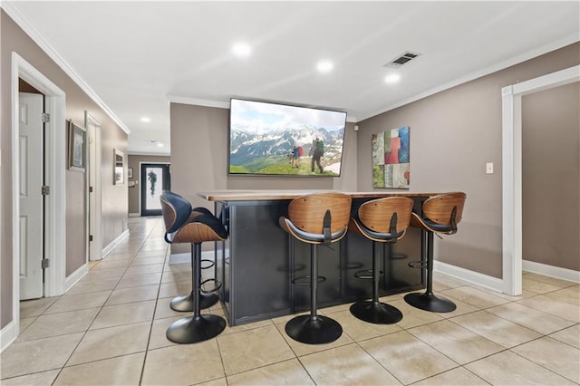 305 Eden Isles Dr, Slidell, LA 70458 - indoor dry bar featuring crown molding, recessed lighting, and light tile patterned floors
