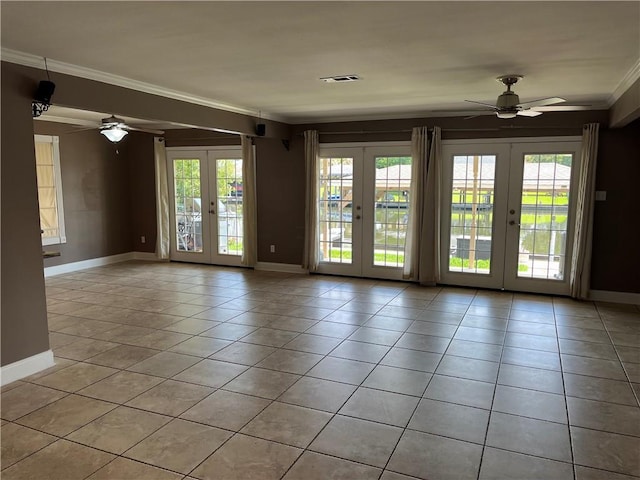 305 Eden Isles Dr, Slidell, LA 70458 - spare room featuring french doors, a ceiling fan, ornamental molding, and light tile patterned floors
