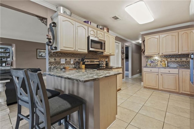 305 Eden Isles Dr, Slidell, LA 70458 - kitchen with appliances with stainless steel finishes, light brown cabinets, a breakfast bar, a peninsula, and ornamental molding