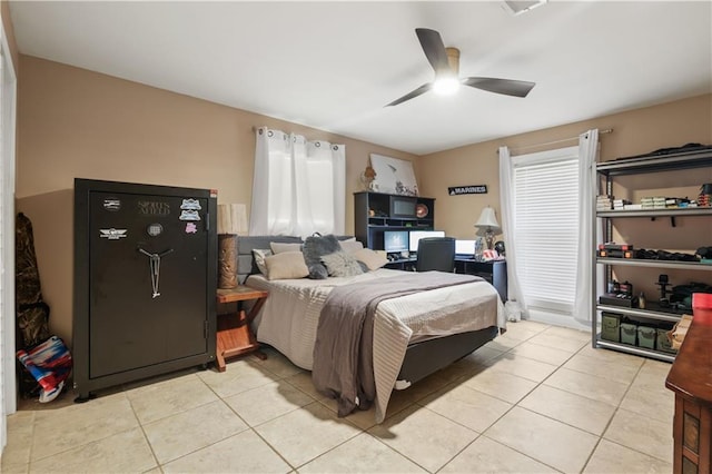 305 Eden Isles Dr, Slidell, LA 70458 - bedroom with light tile patterned floors and ceiling fan
