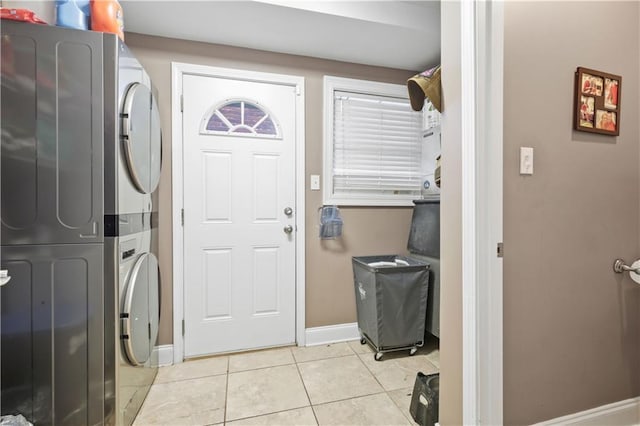 305 Eden Isles Dr, Slidell, LA 70458 - laundry room with stacked washer and clothes dryer and light tile patterned flooring