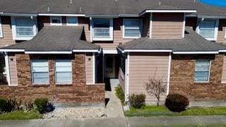 view of front of home with brick siding