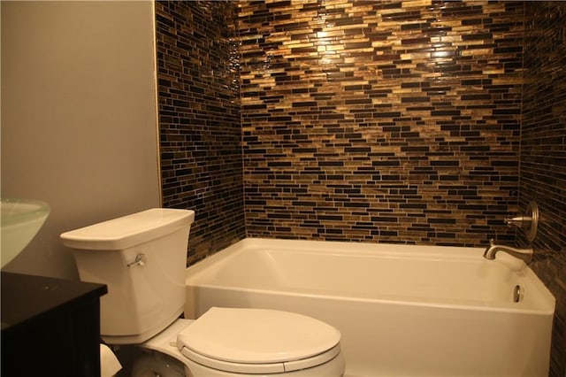 bathroom featuring  shower combination, vanity, and toilet