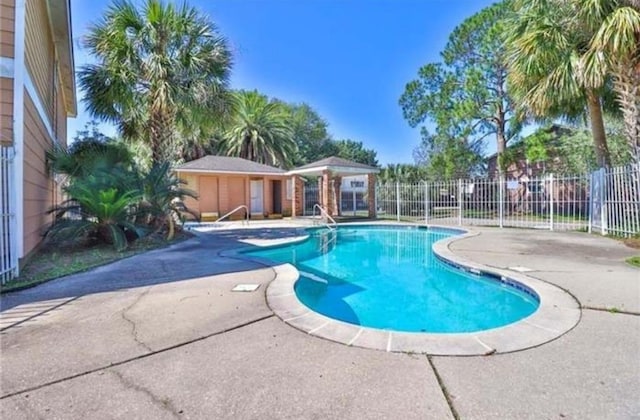 view of swimming pool with a fenced in pool, a patio area, and fence