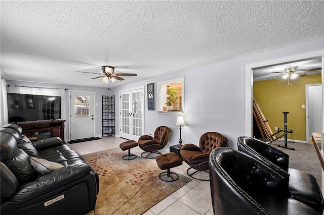1433 Meadowlawn St, Slidell, LA 70460 - living room featuring tile patterned floors, ceiling fan, french doors, and a textured ceiling