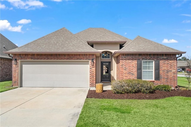 view of front of property with an attached garage, a shingled roof, brick siding, concrete driveway, and a front lawn