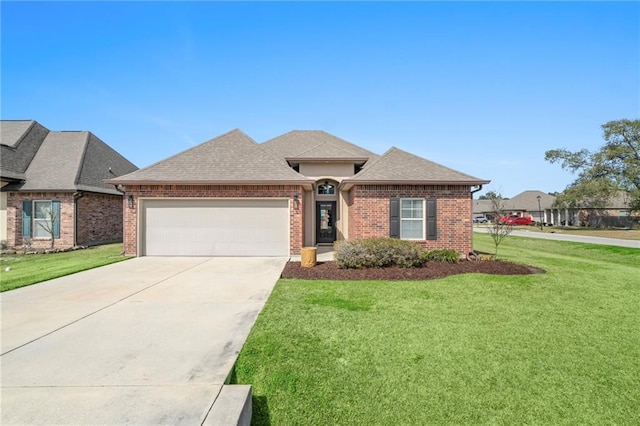 view of front of house with concrete driveway, an attached garage, and a front lawn