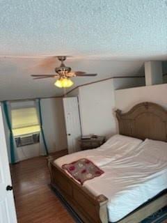 bedroom featuring wood finished floors and a ceiling fan